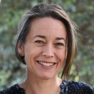 A head and shoulders photo of the author. She is smiling and looking at the observer